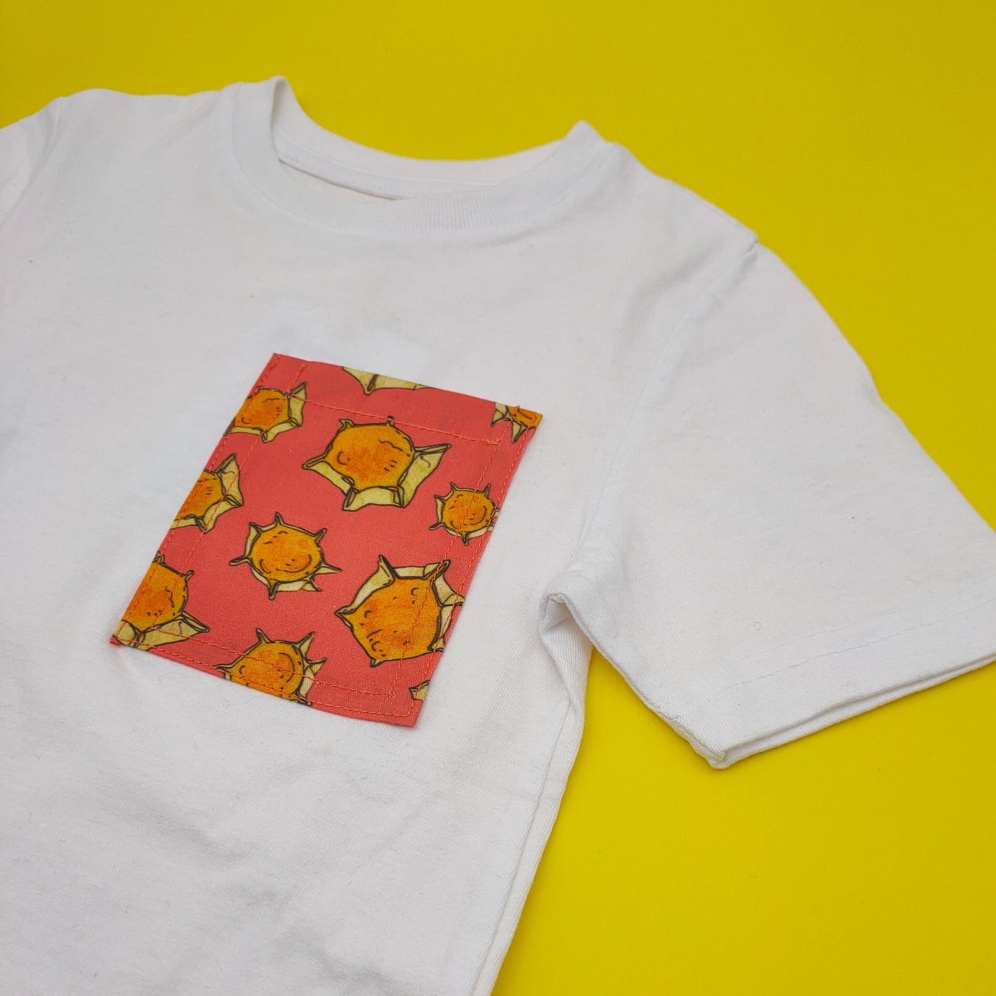T-shirt baby con taschino fantasia